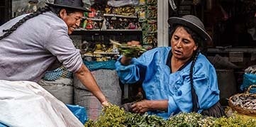 Vendors at a vegetable stall in Peru. Photo by Carloman Macidiano Céspedes Riojas, CGAP Photo Contest