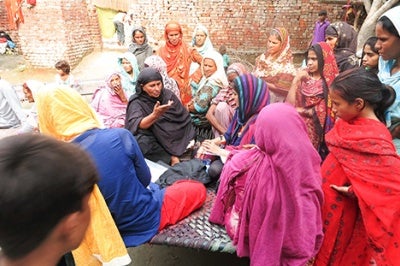 Women in Pakistan gather in a group to discuss financial habits, needs, and challenges with using formal financial services. 