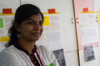 Woman employee at Janalakshmi, India, works on customer empowerment for low-income customer segments